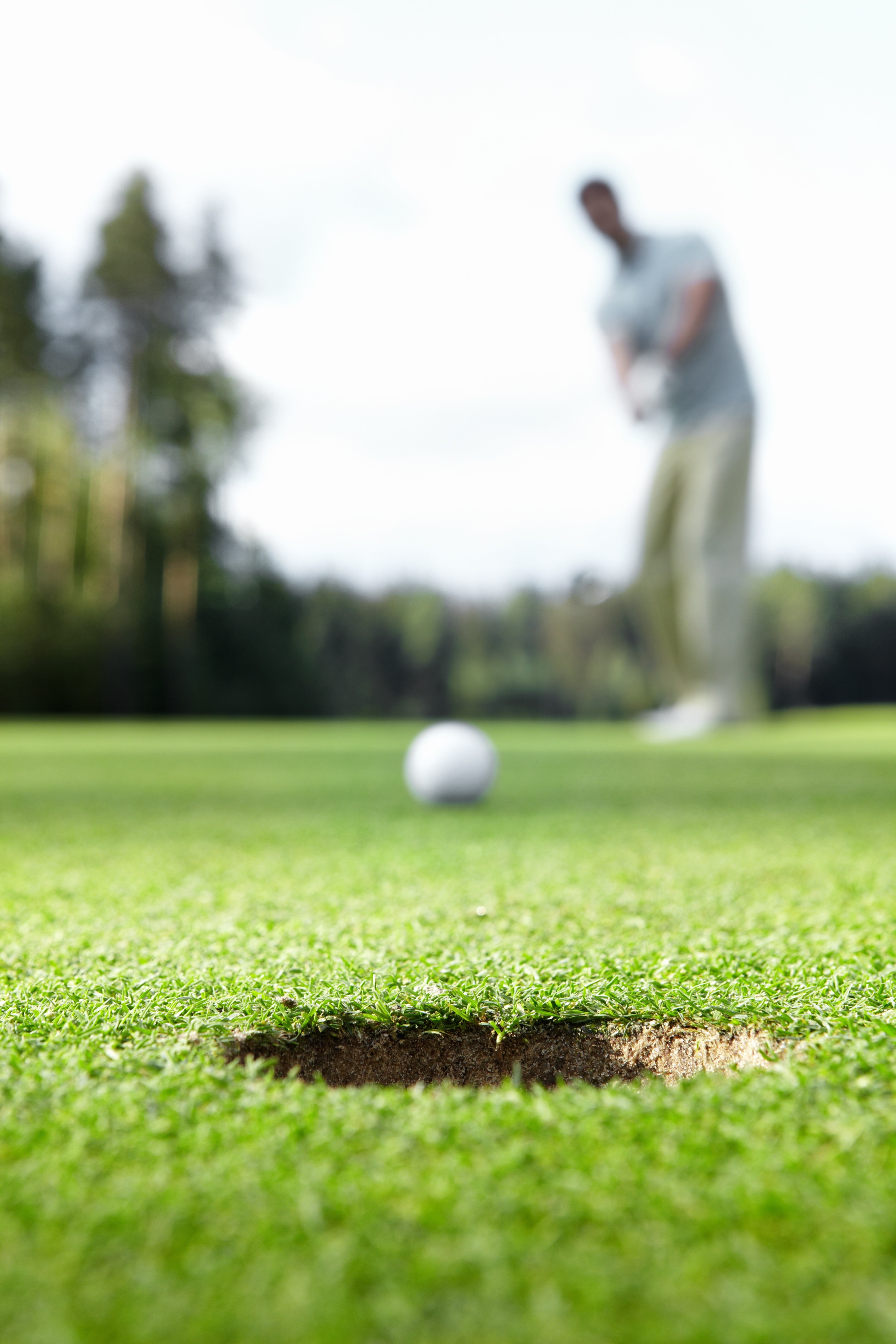 A man playing golf