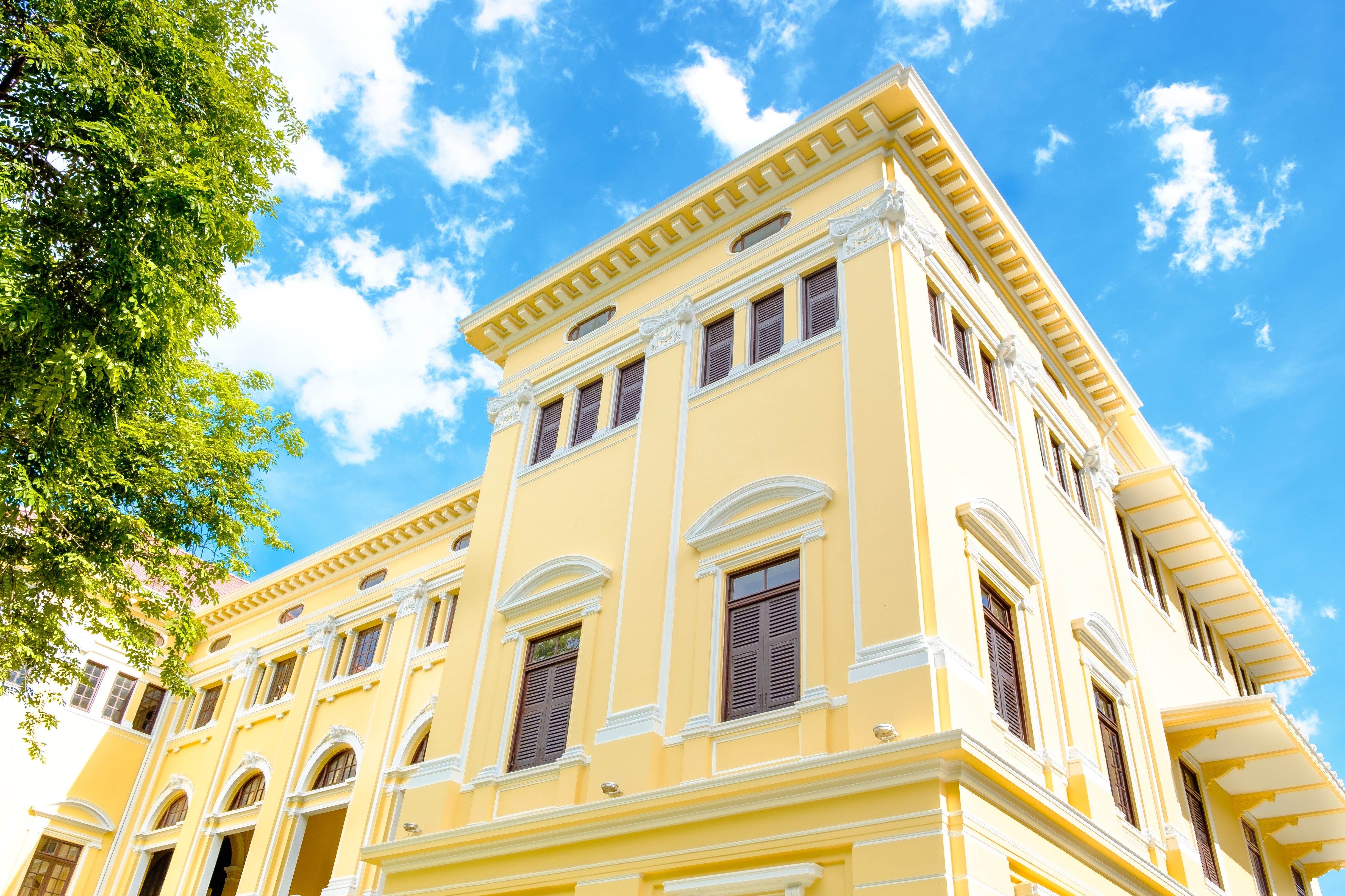 Museum Siam : The public museum in Bangkok Thailand. Renovate from the old building. A Classic yellow building with blue sky background