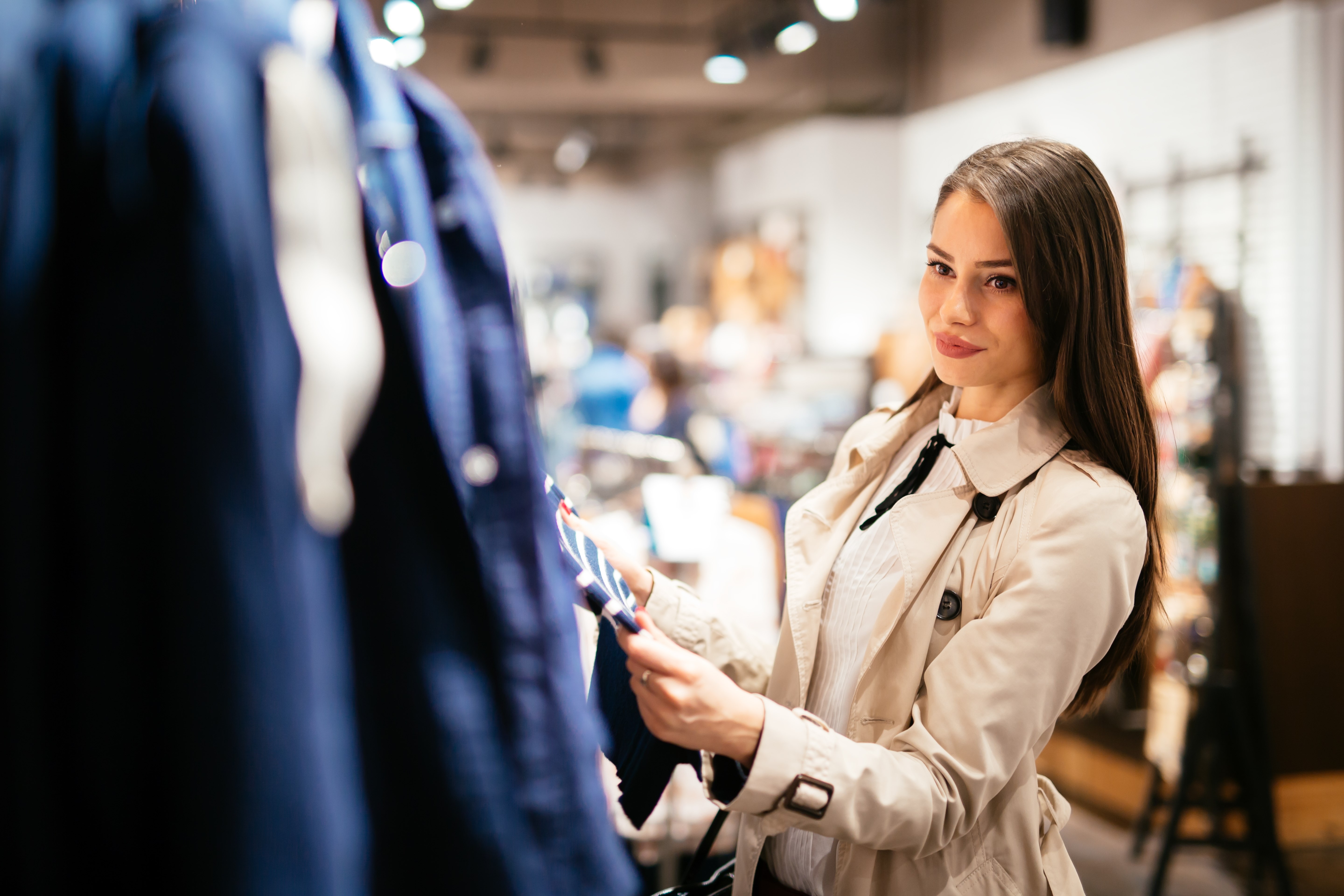 Beautiful woman buying clothes