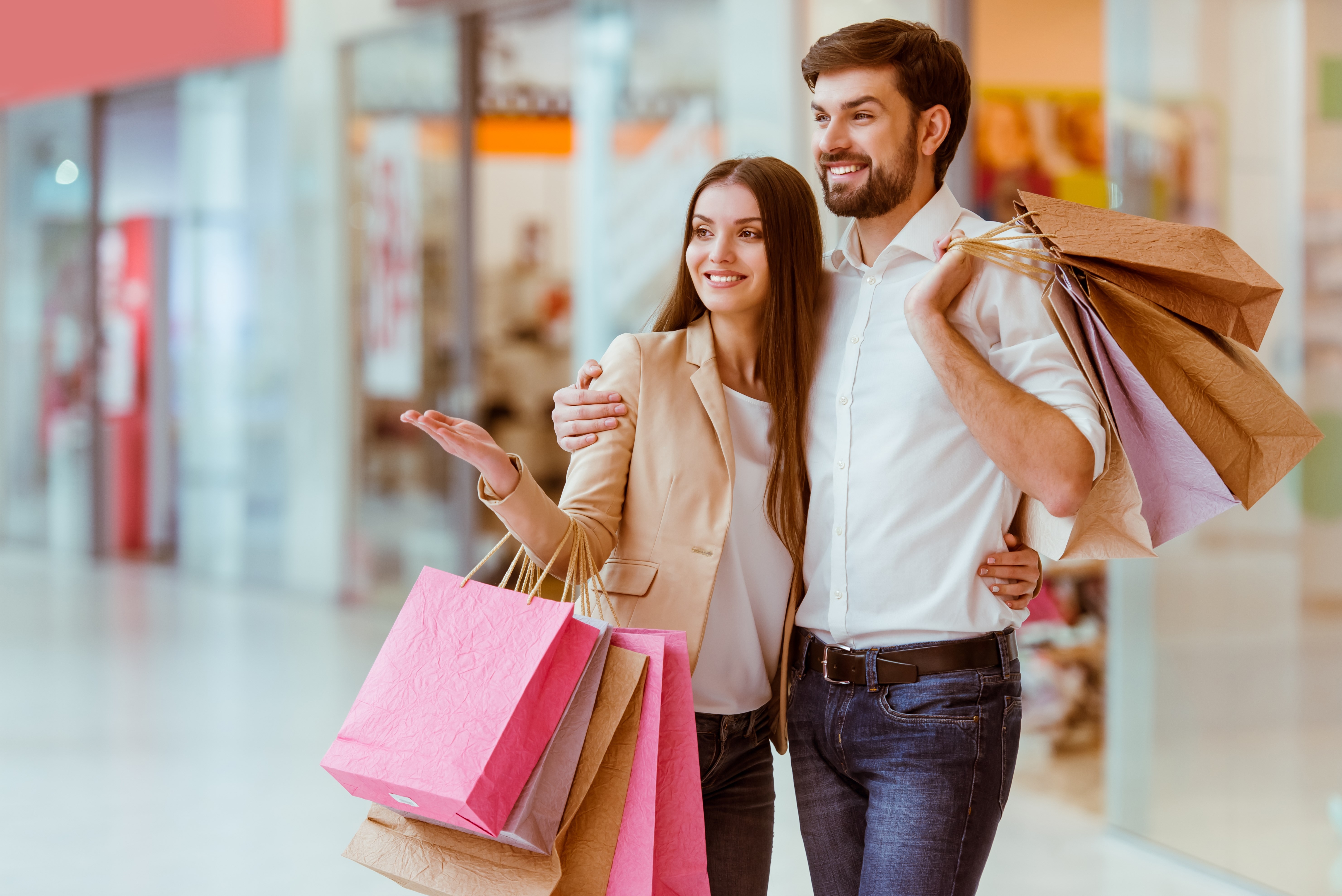 Young couple holding shopping bags