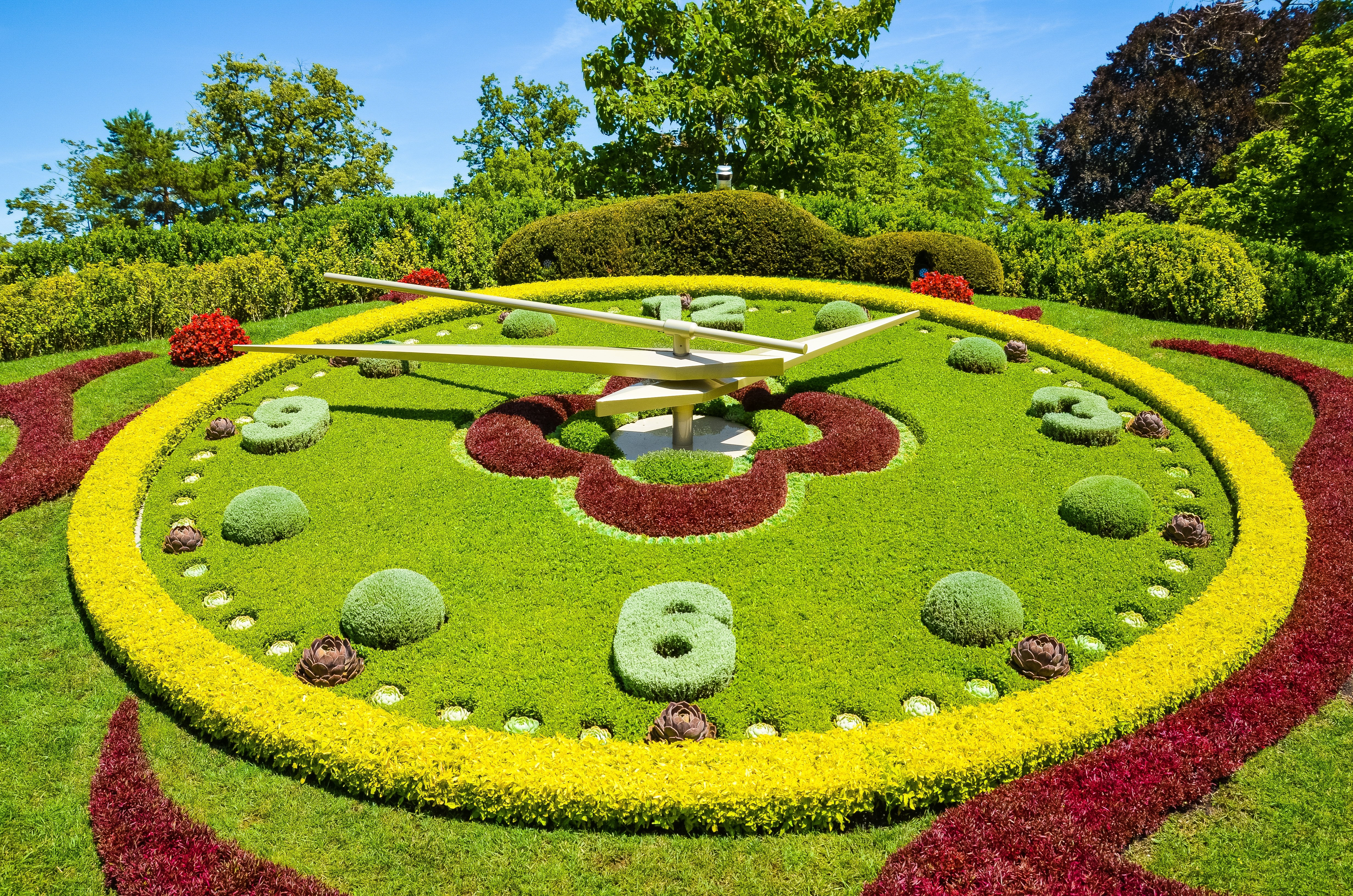 Flower clock in Geneva, Switzerland. L'horloge fleurie in French, outdoor flower clock located on the western side of Jardin Anglais park. Created in 1955 as a symbol of the city's watchmakers