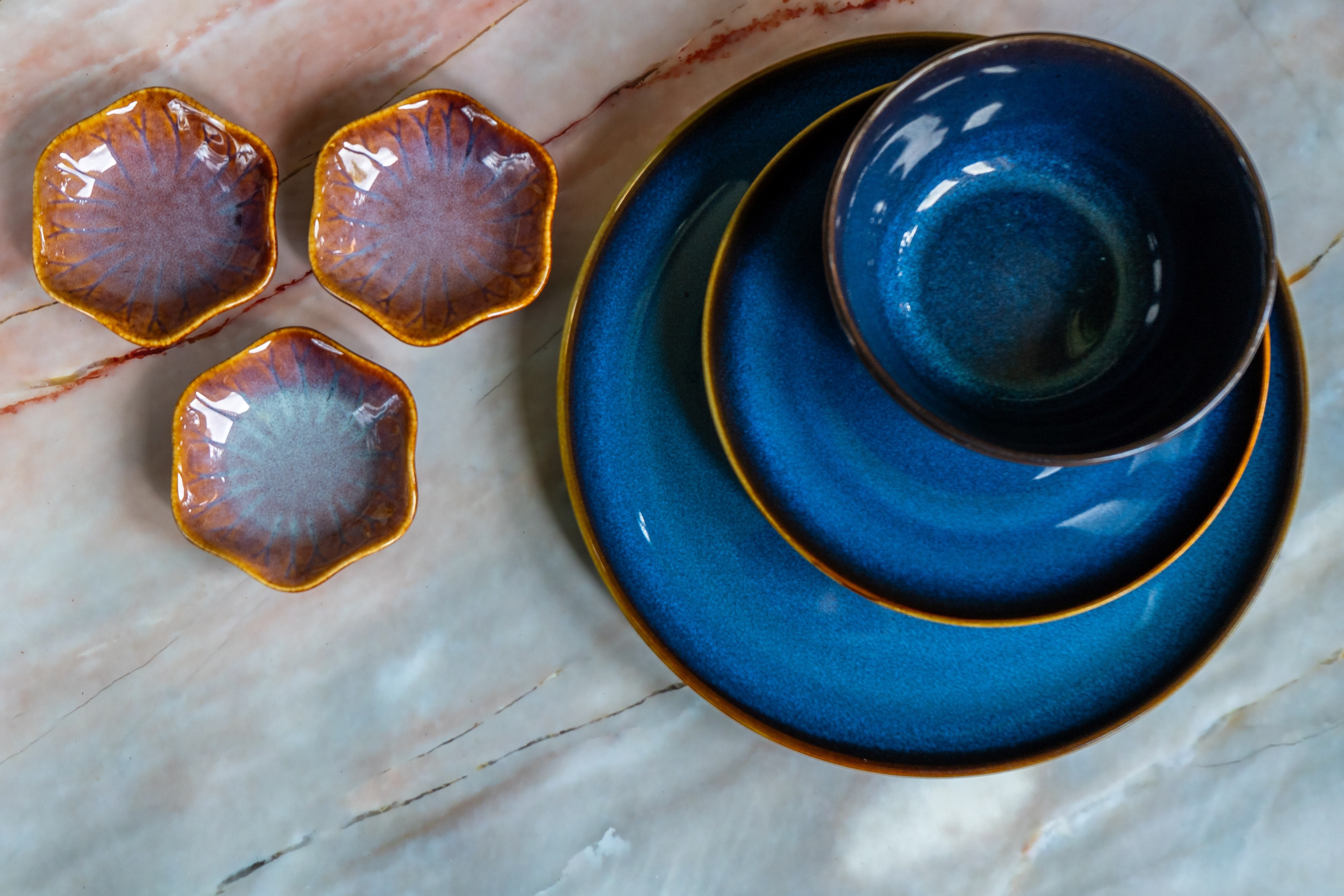 An abstract image of dark blue ceramic dishes.