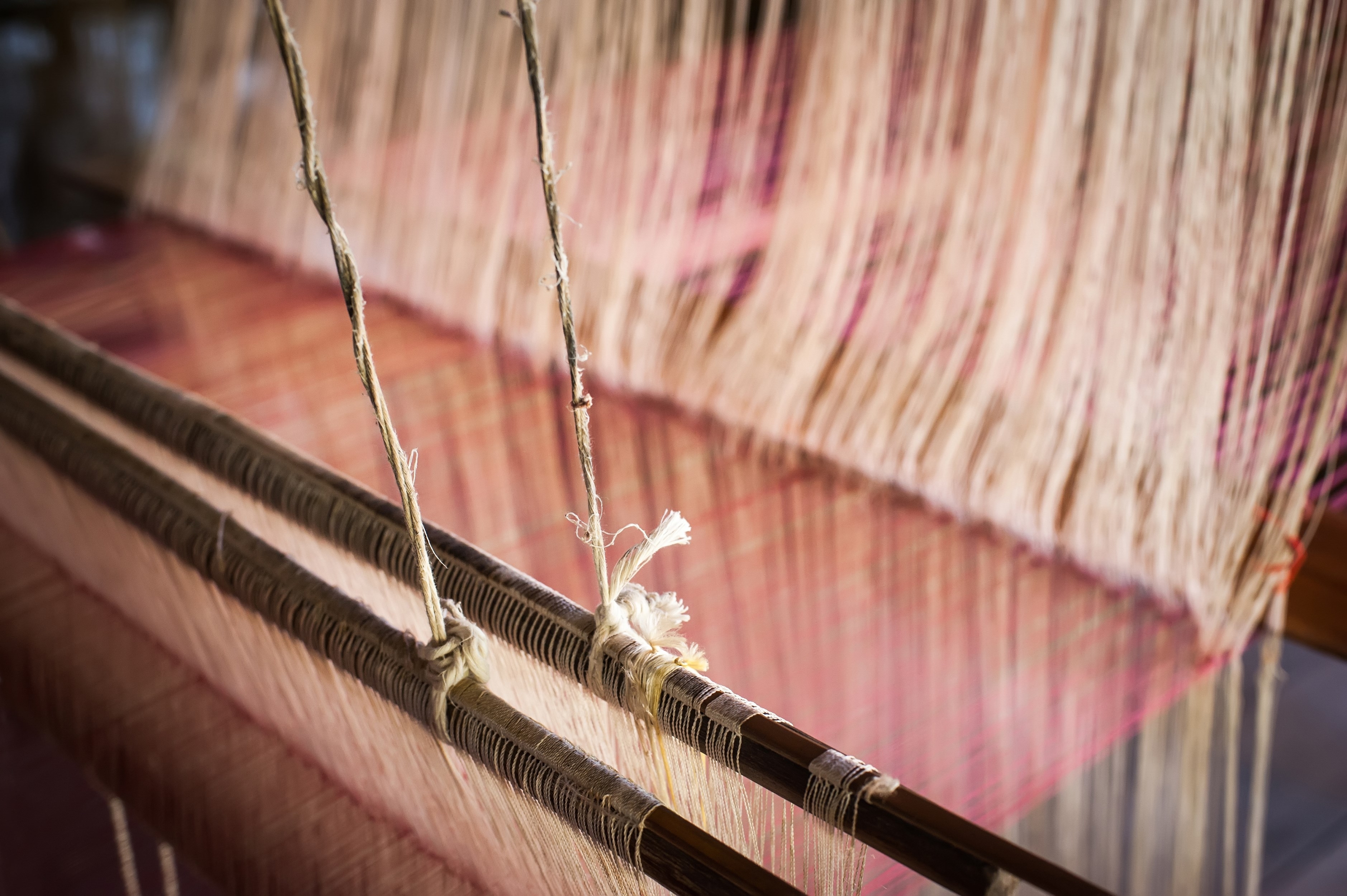 Vintage manual weaving loom with unfinished textile work