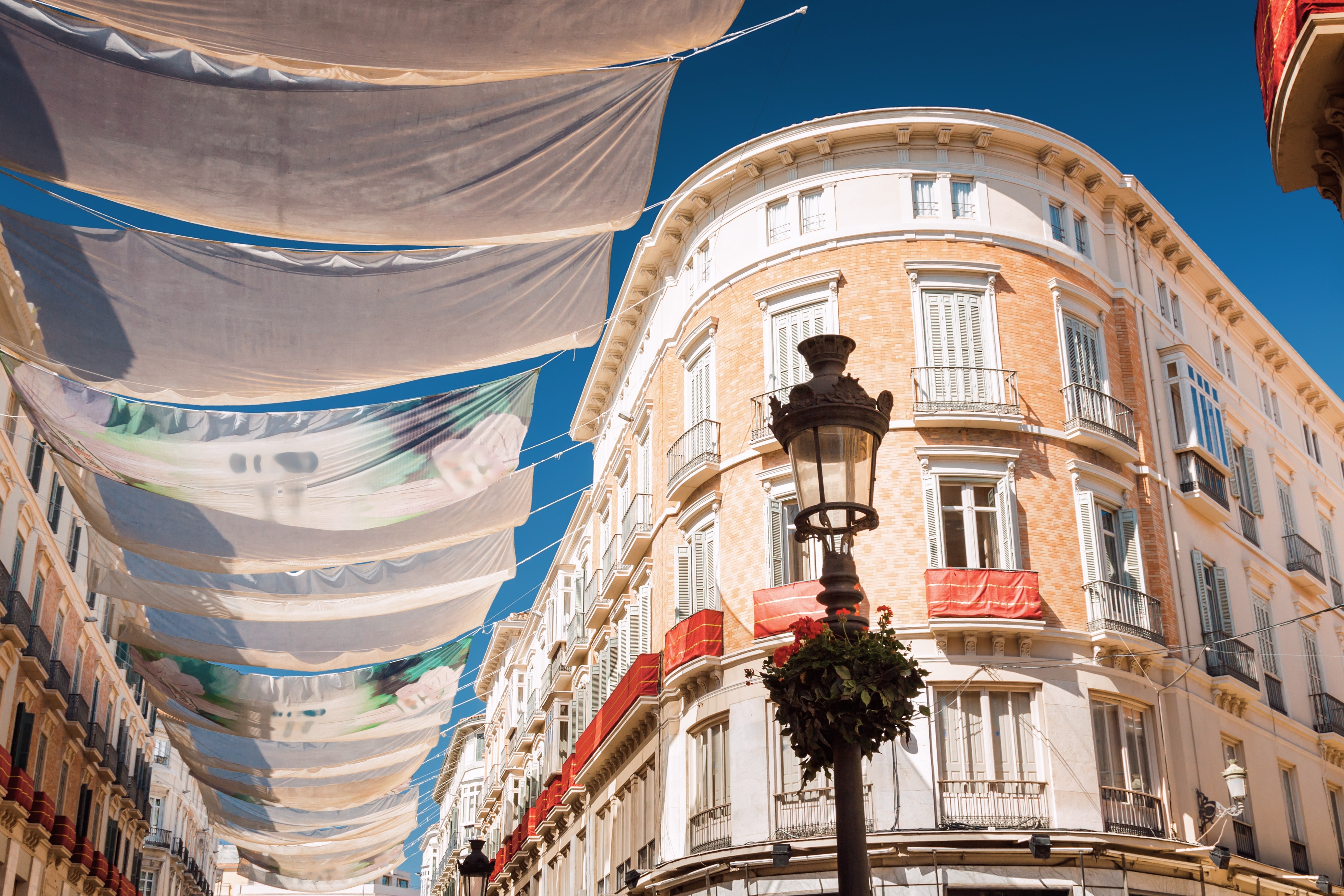 Sunny view of Larios street in Malaga, Andalusia province, Spain.