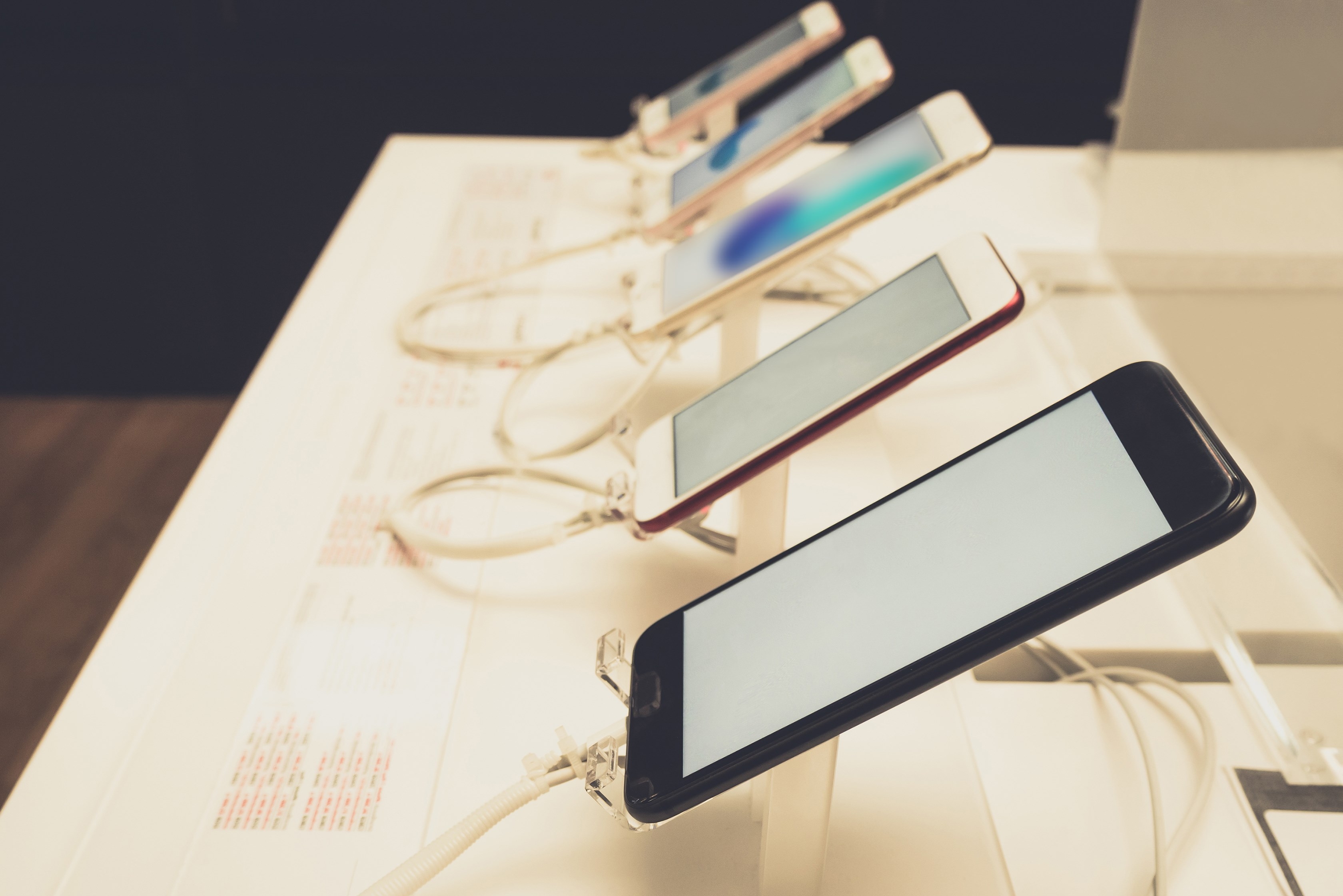 mobile smartphone in store vintage tone