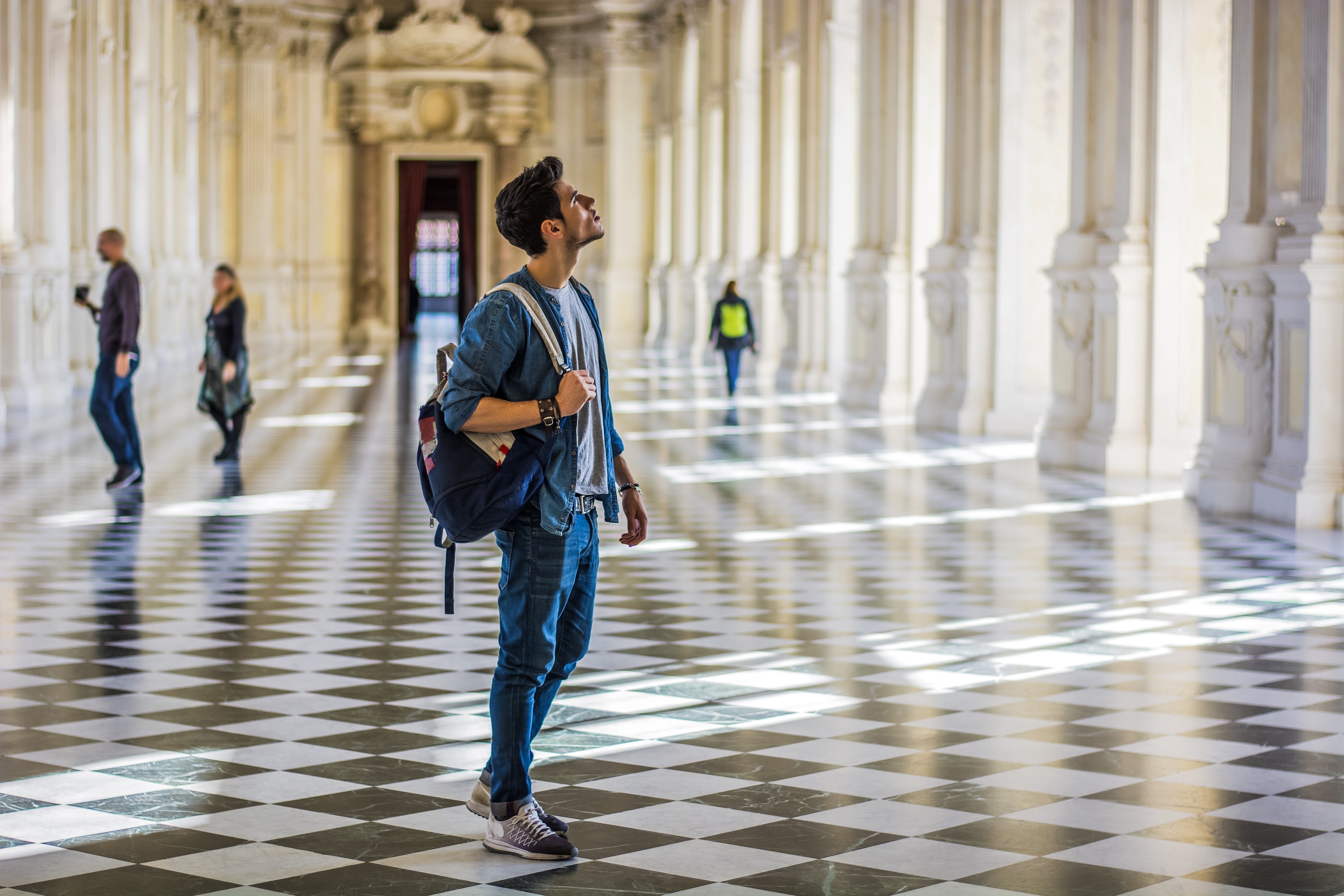 Man Holding a Guide Inside a Museum