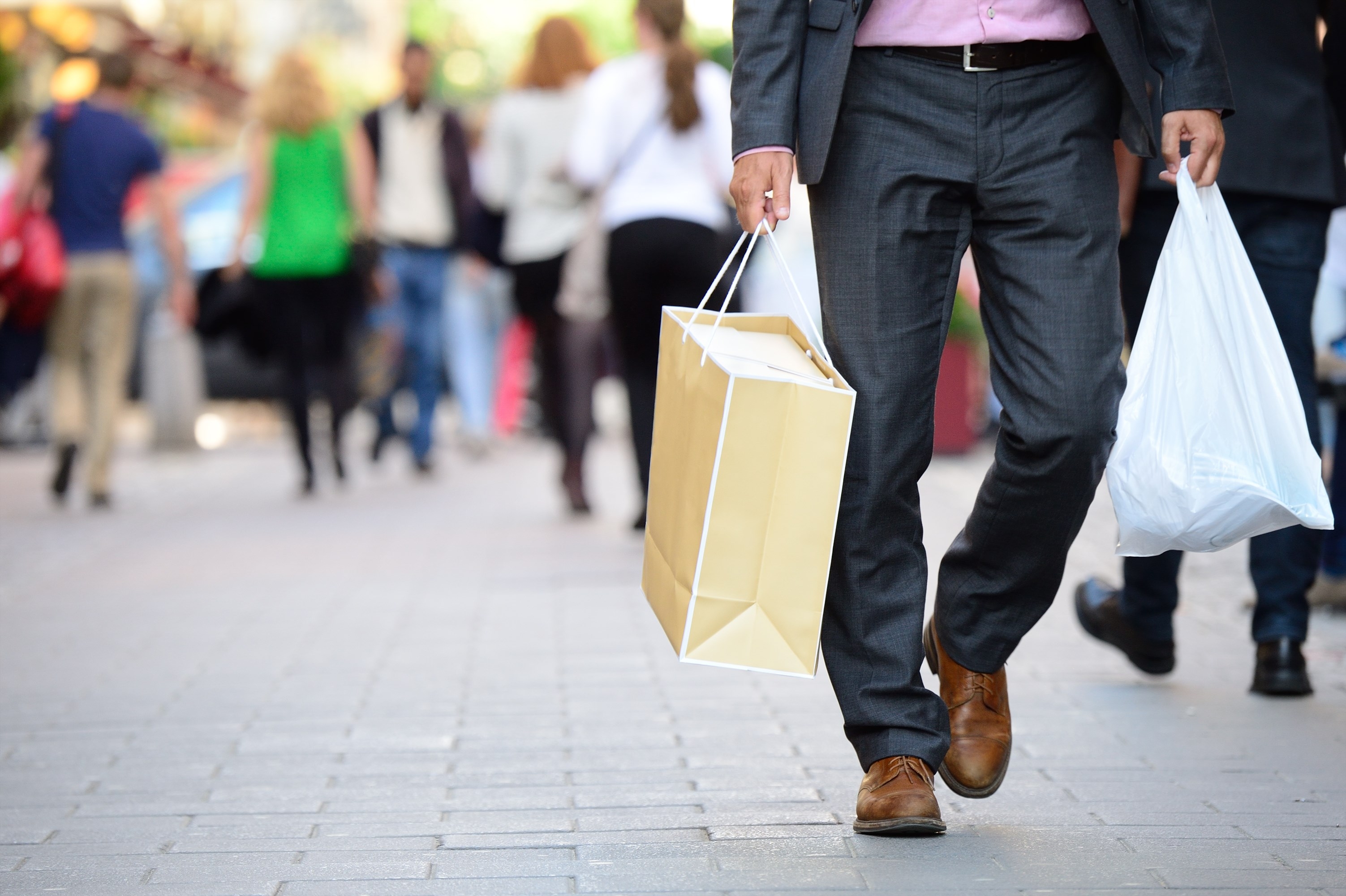 Man with shopping bags in the street
