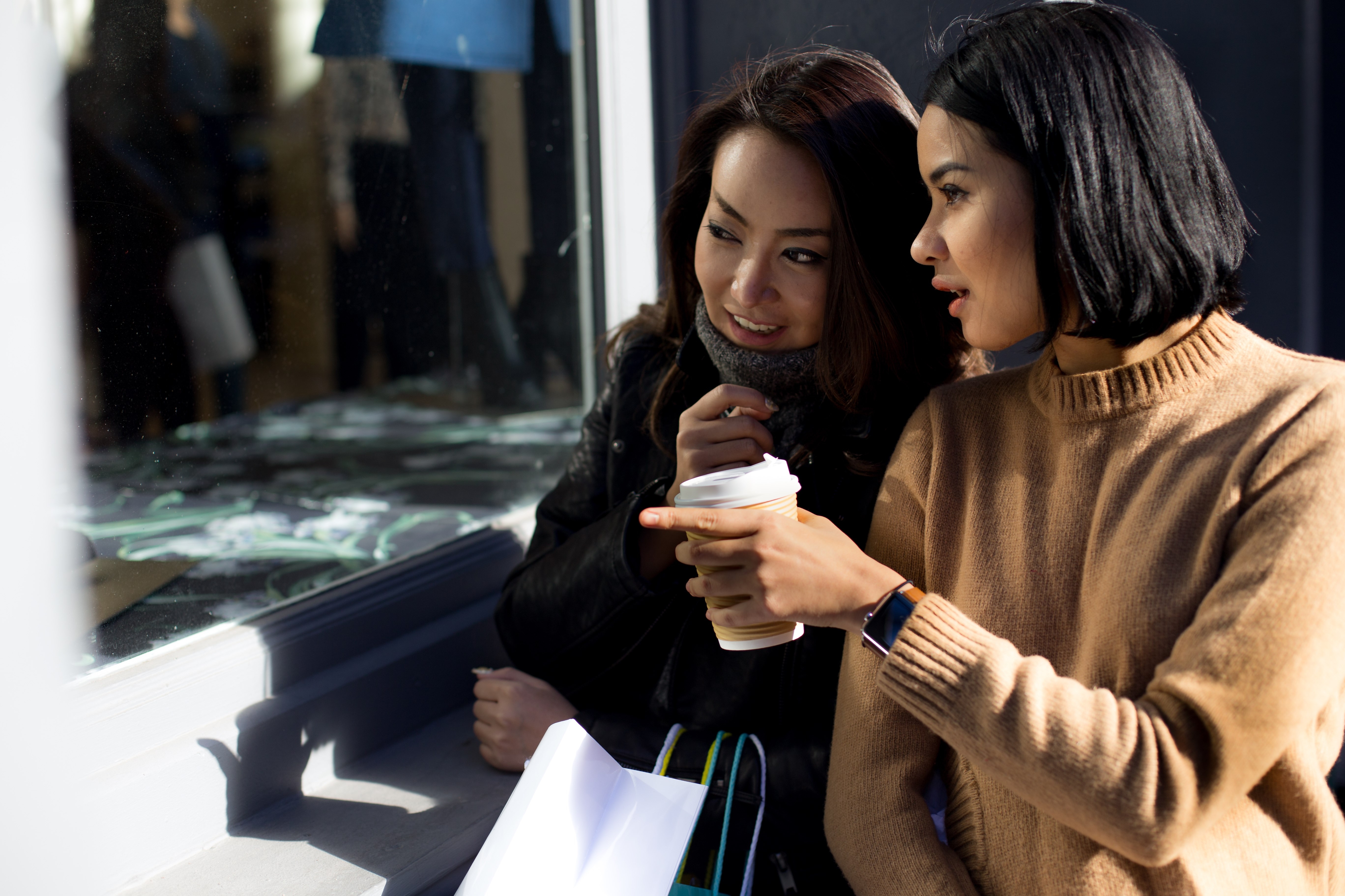 two friends are window shopping