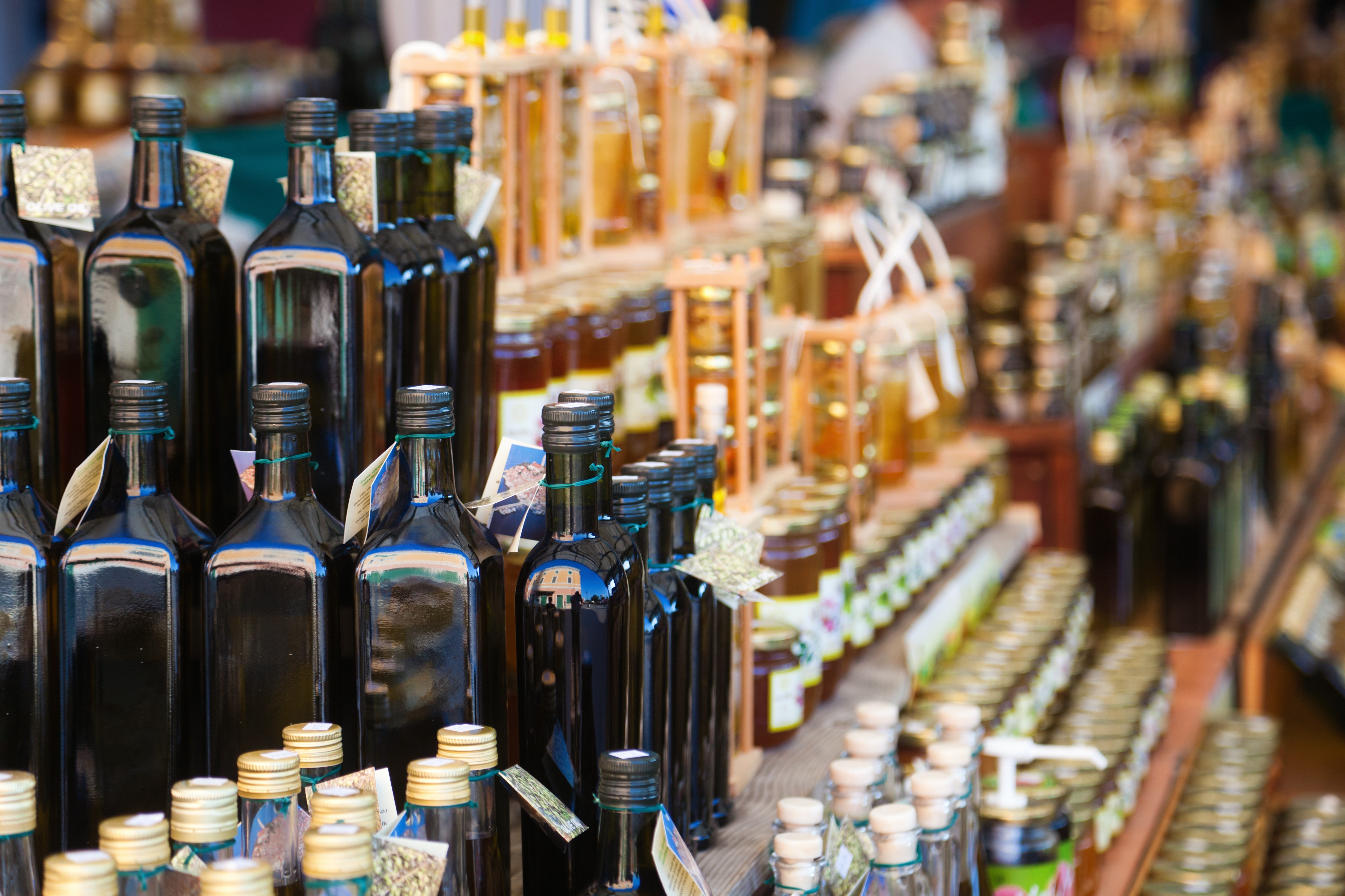 croatian market stall with local olive oil and other goods