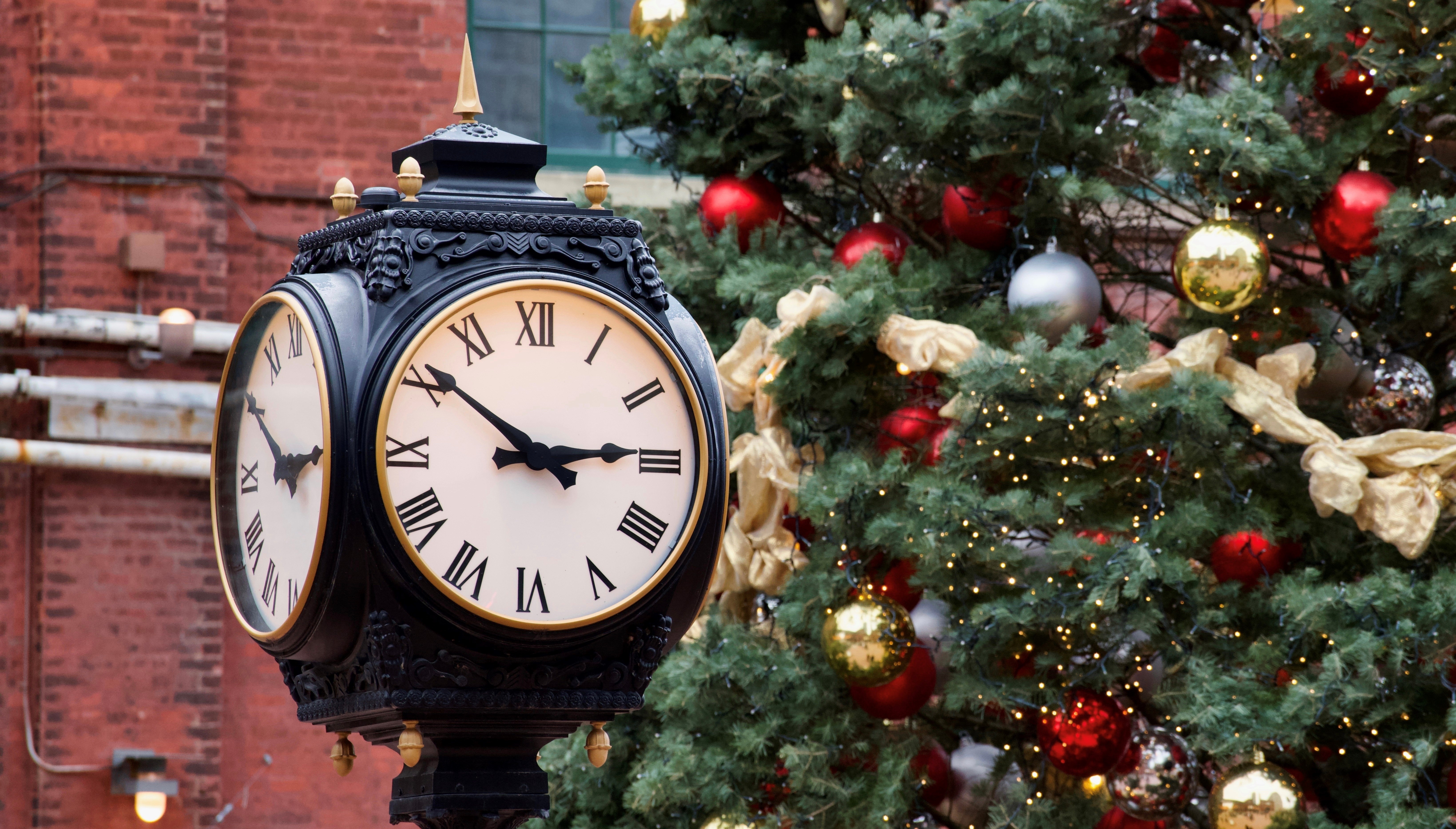 Illuminated Christmas Tree and Vintage Clock during Christmas in Distillery District, Toronto