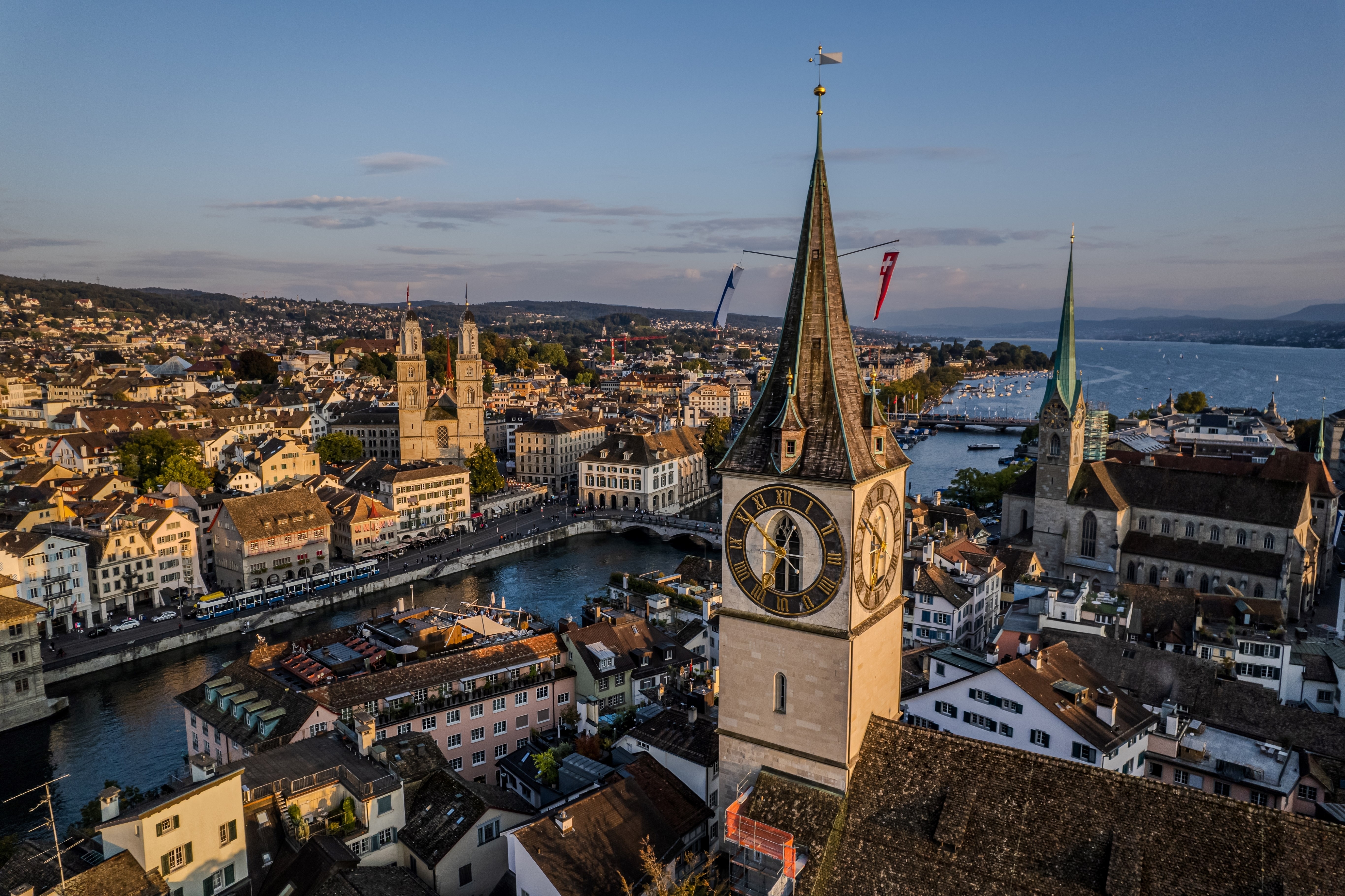 Beautiful aerial view of the St. Peter church in the city of Zurich in Switzerland and its iconic churches, buildings rivers and Clockes.