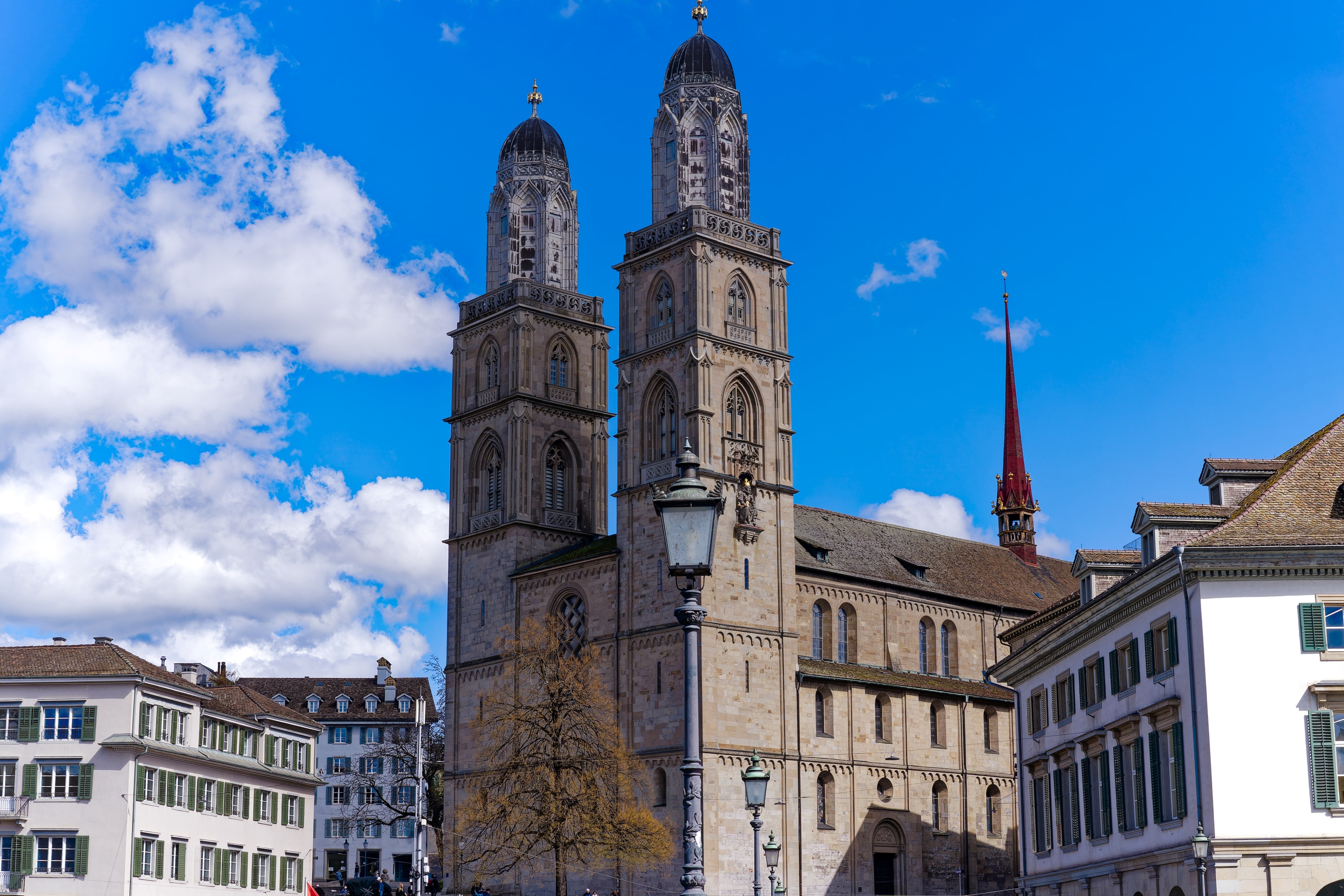Grossmünster, Great minster church at the medieval old town at Swiss City of Zürich on a blue cloudy spring day.