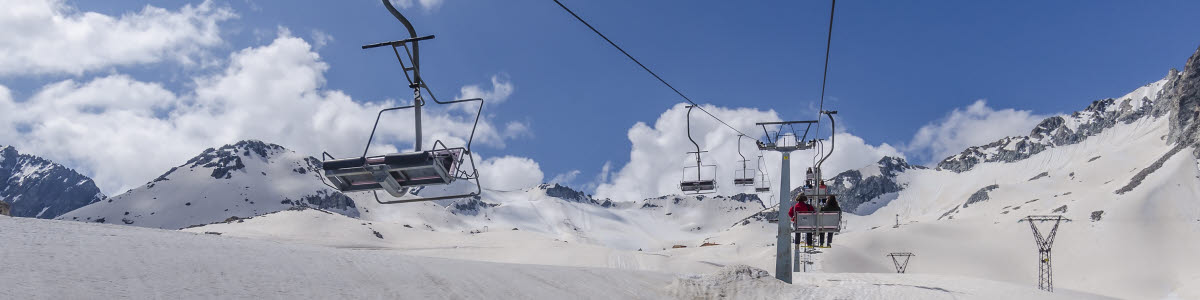 Cable car for skiers in the mountains of Northern Italy Alps on a clear sunny day Cable car for skiers in the mountains of Northern Italy Alps on a clear sunny day