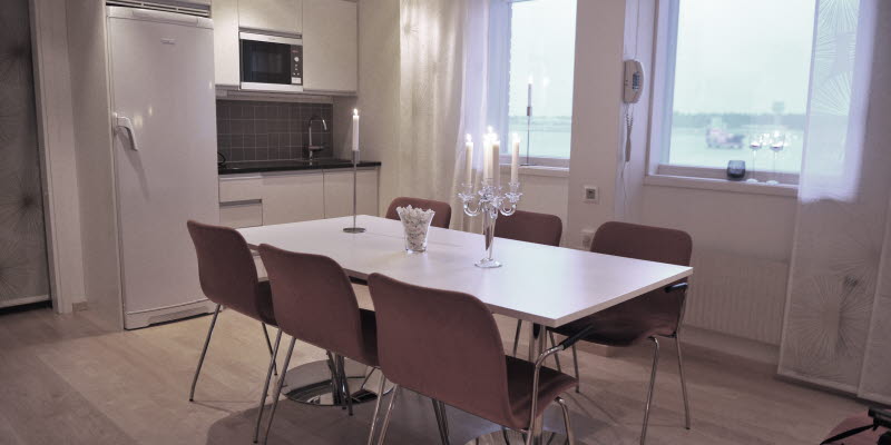 Conference room at Luleå Airport with a lit candelabrum at a table Conference room at Luleå Airport with a lit candelabrum at a table