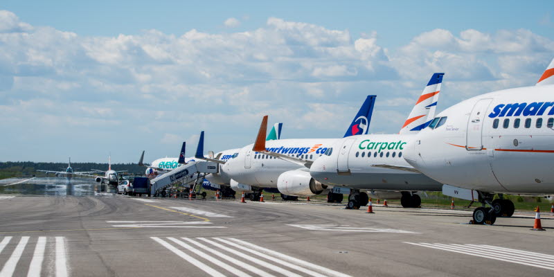 Aircrafts parked at a runway Aircrafts parked at a runway