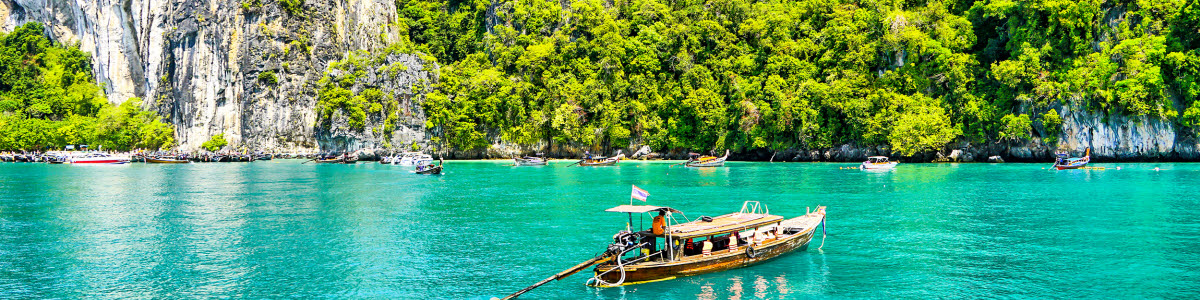 Boat on tuquiose water in thailand Boat on tuquiose water in thailand