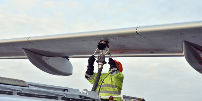 Crew refueling an aircraft with biofuel Crew refueling an aircraft with biofuel