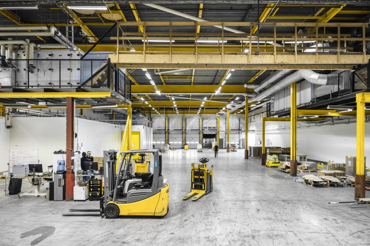 Yellow trucks inside a goods terminal Yellow trucks inside a goods terminal