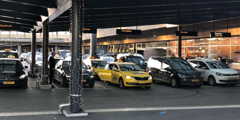 Taxis standing under a roof Taxis standing under a roof