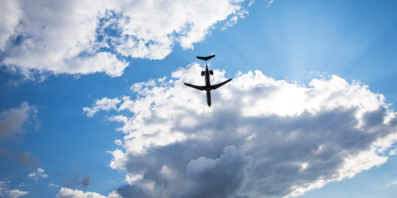 Airplane up in the air with blue sky and clouds Airplane up in the air with blue sky and clouds