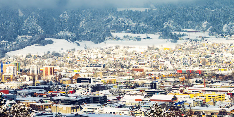 Innsbruck, Austria. Aerial view of Innsbruck, Austria during the winter morning, with snow and mountains at the background. Innsbruck, Austria. Aerial view of Innsbruck, Austria during the winter morning, with snow and mountains at the background.