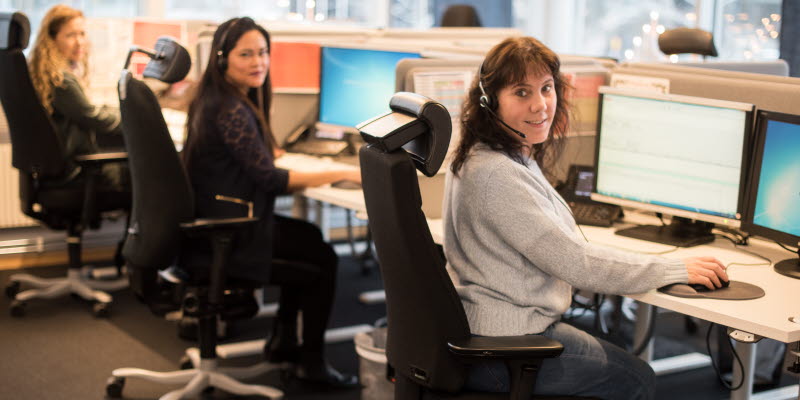 Support team Three women sitting in front of computers
