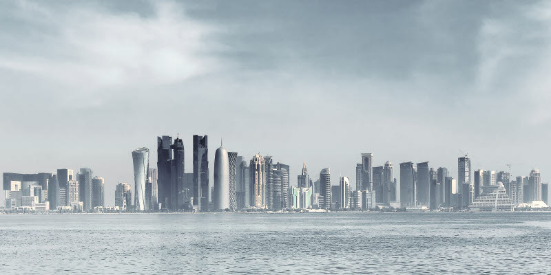 Futuristic skyline of Doha,Qatar..Doha is a city on the coast of the Persian Gulf, the capital and largest city of the Arab state of Qatar. Futuristic skyline of Doha,Qatar..Doha is a city on the coast of the Persian Gulf, the capital and largest city of the Arab state of Qatar.