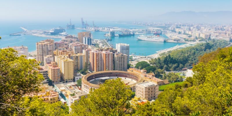 View of Malaga with bullring and harbor. Spain View of Malaga with bullring and harbor. Spain