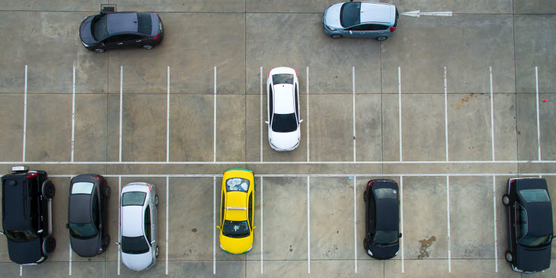 Parkinglot with cars that are parked and that are about to park Parkinglot with cars that are parked and that are about to park