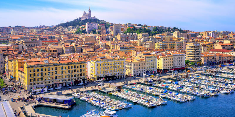 The old Vieux Port and Basilica Notre Dame de la Garde in the historical city center of Marseilles, France The old Vieux Port and Basilica Notre Dame de la Garde in the historical city center of Marseilles, France